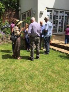 Several woodland members enjoying the sun and refreshments in Tim Barnes’ garden