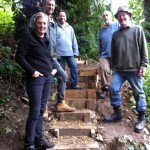Volunteers standing in front of newly created steps.