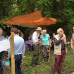 Volunteers and the public discussing the woodland